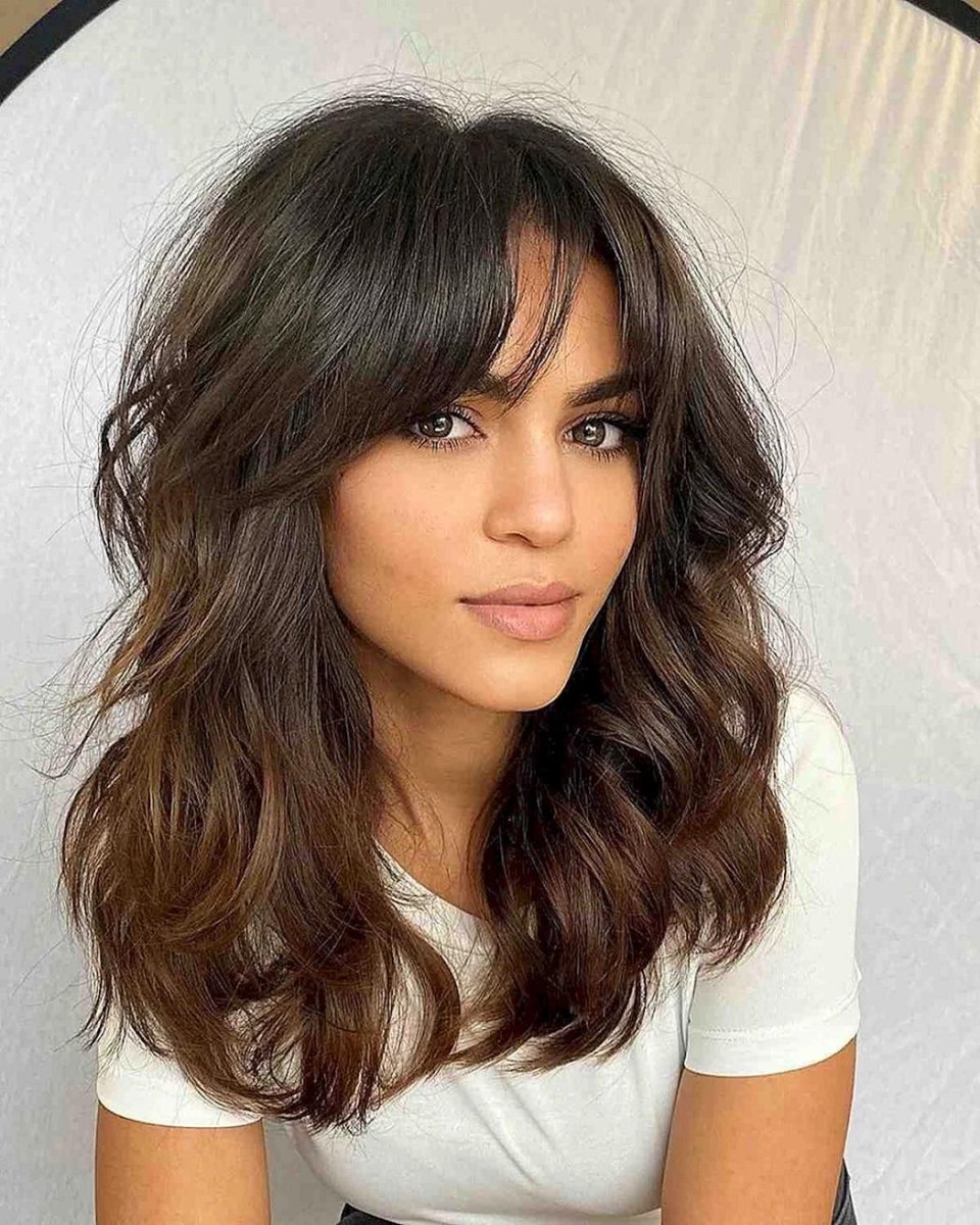 Brunette wavy wispy curtain bangs