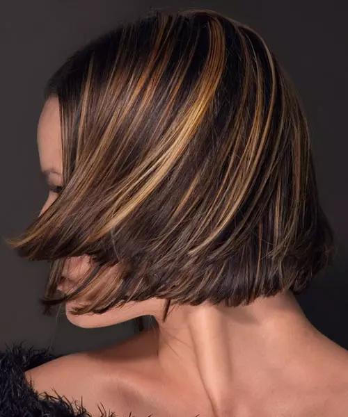 Chin length brown bob with bright highlights