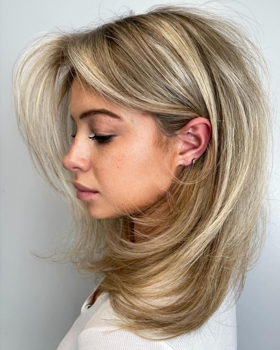 Glossy dark layered blowout haircut with long layers