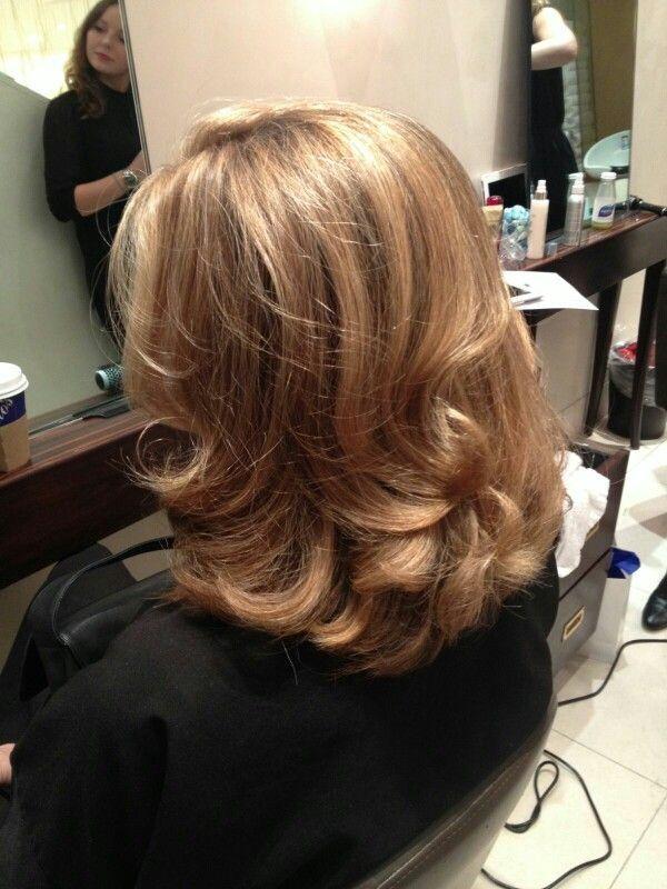 Warm brown layered blowout haircut with rounded ends