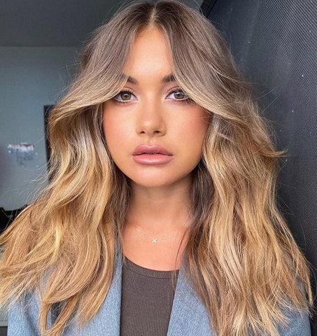 Middle part wispy curtain bangs style