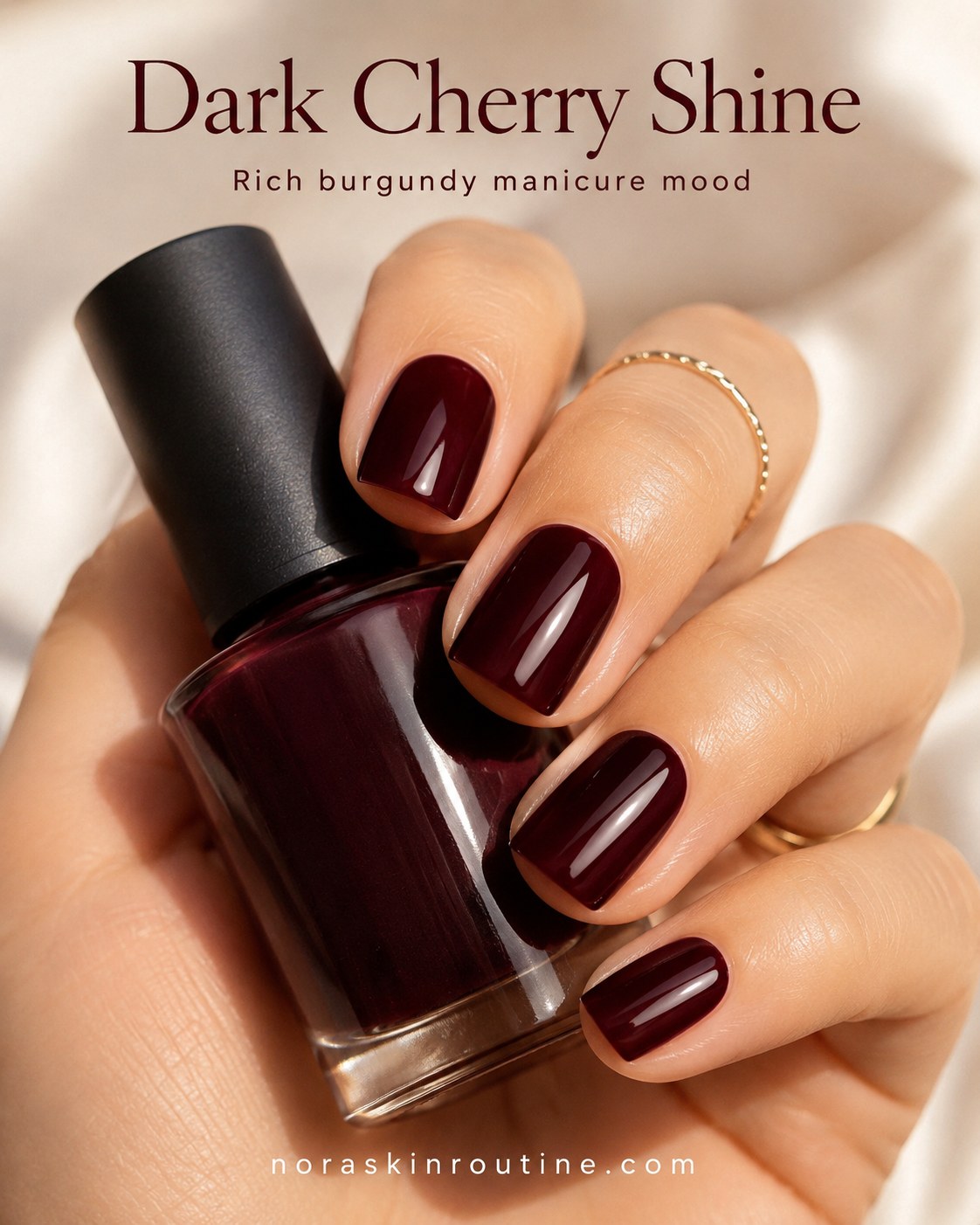 Dark cherry burgundy nail polish glides over deep skin tones for a rich, glossy autumn manicure.