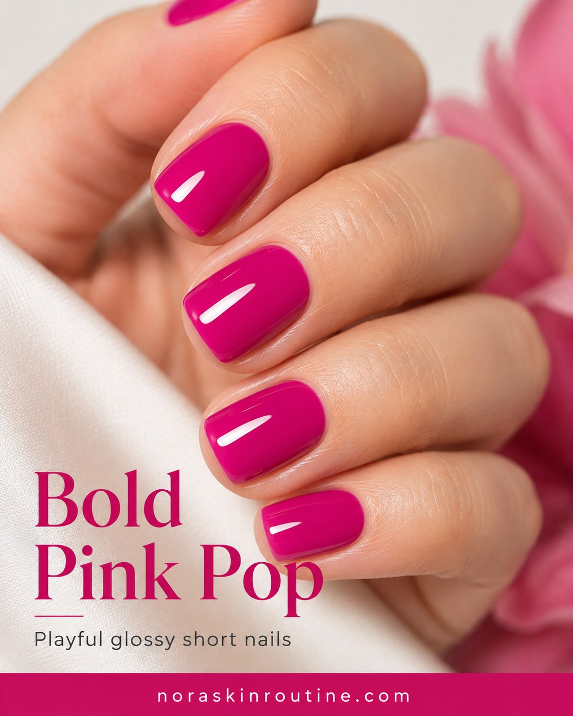 Bold magenta pink nail color pops against deep skin tones on short, glossy round nails.