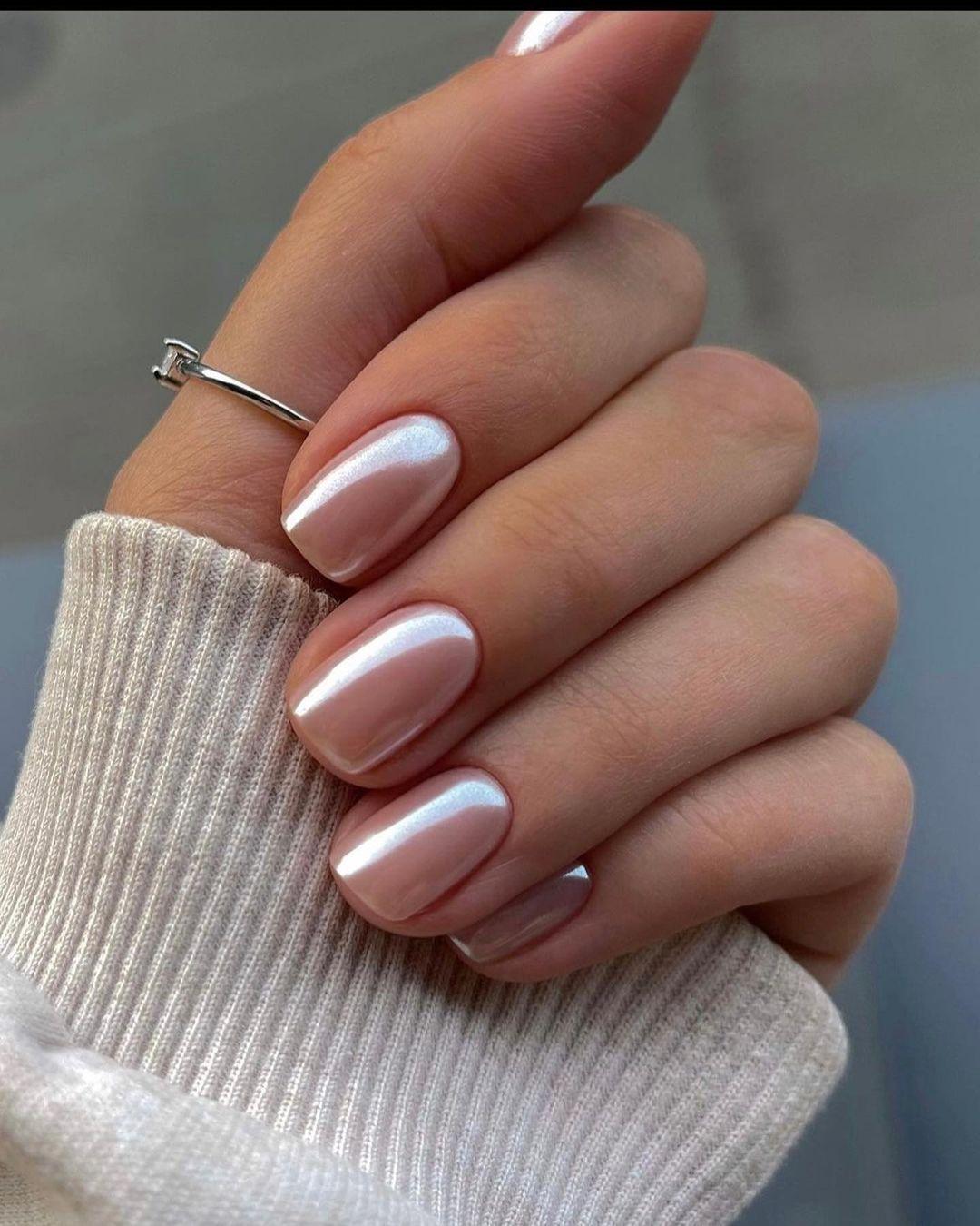 Nude pink chrome glow nails