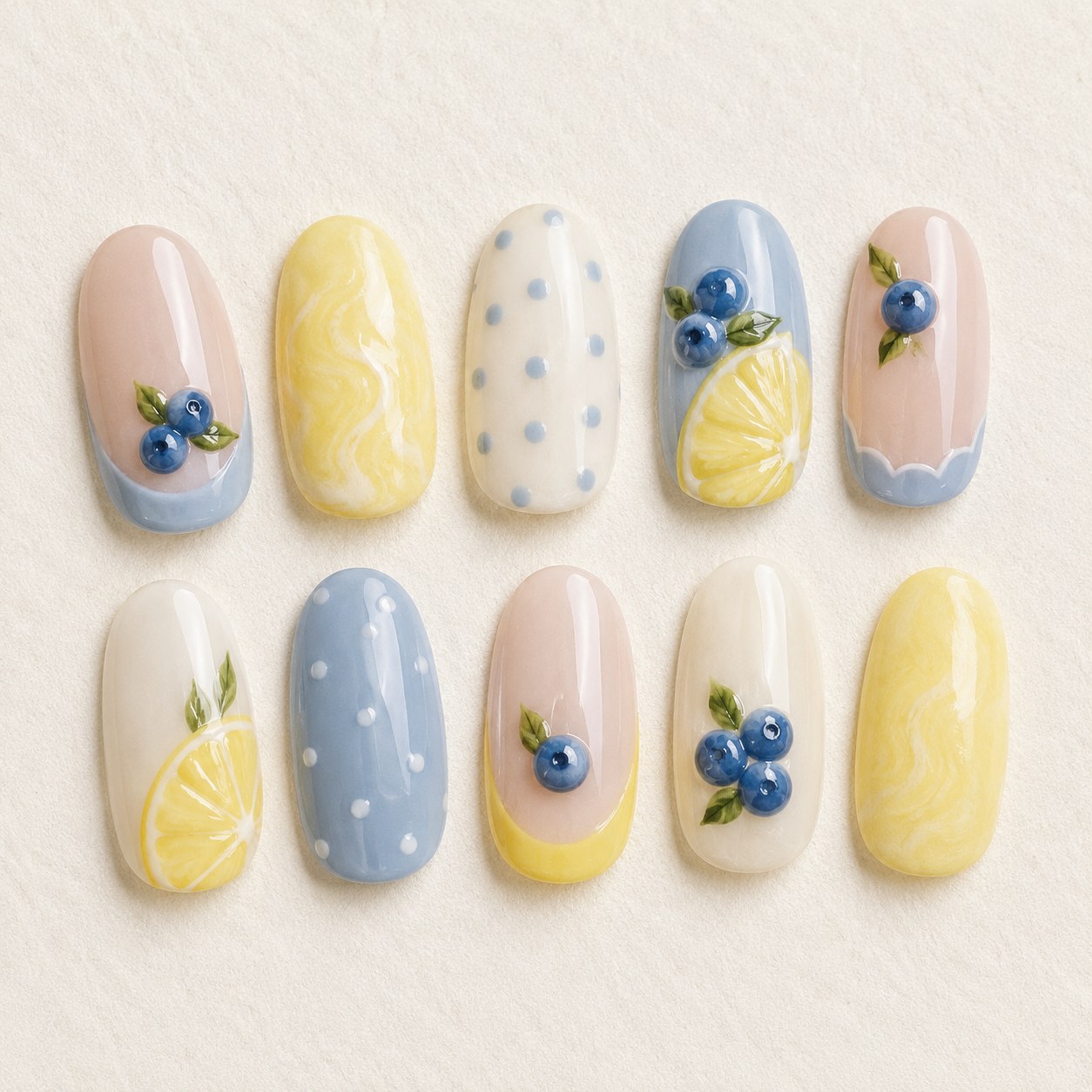 Lemon and blueberry pastel nail art design for a fresh spring manicure