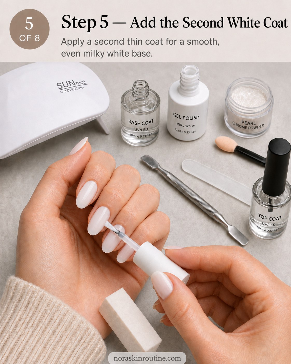 Adding a second smooth white coat to build opacity for pearl chrome nails