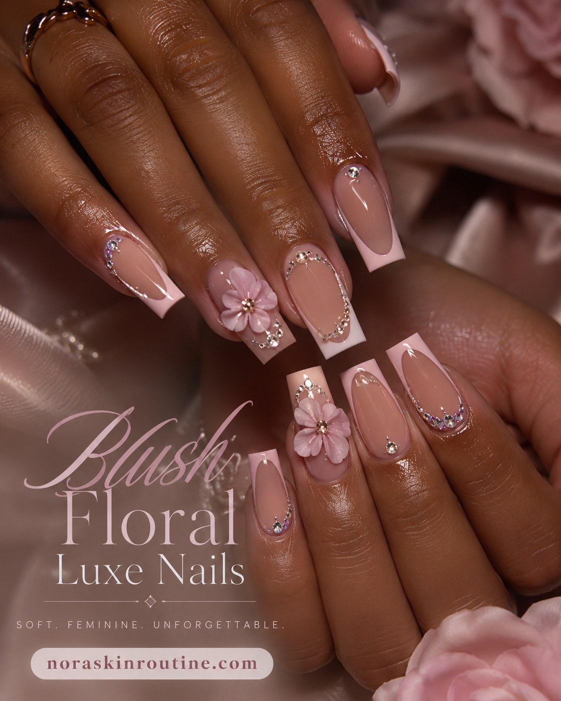 Blush pink french tip nails with 3D flowers and rhinestones for a luxe finish