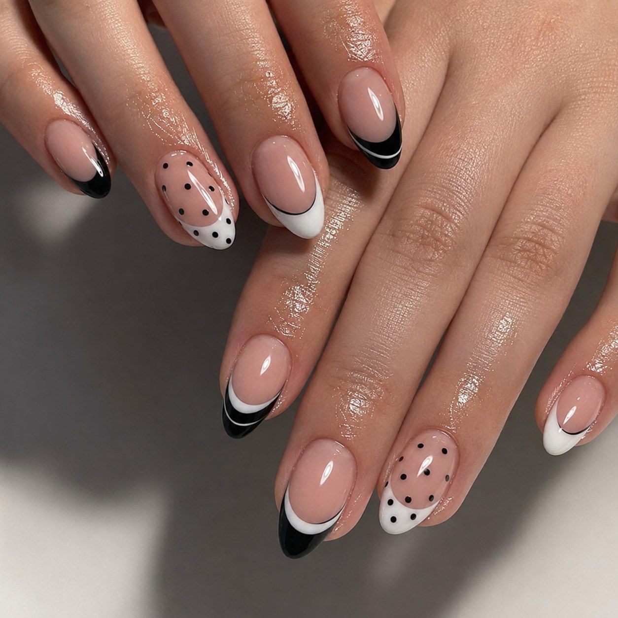 Black and white French tip polka dot nail art with glossy accent nails