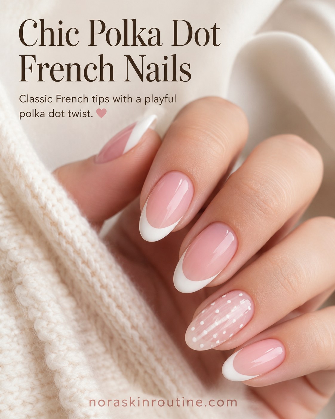 Short french tip nails with a chic polka dot accent nail detail