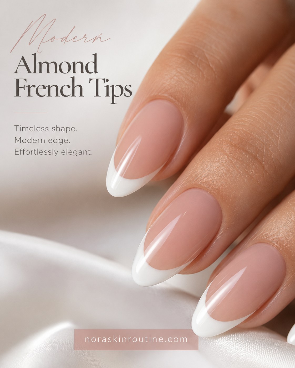 Short french tip nails in a modern almond shape with a rounded white edge