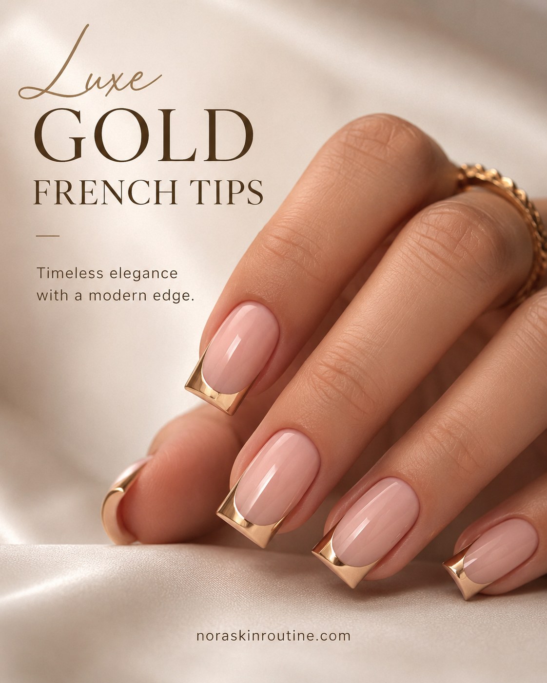 Short french tip nails finished with luxe metallic gold tips