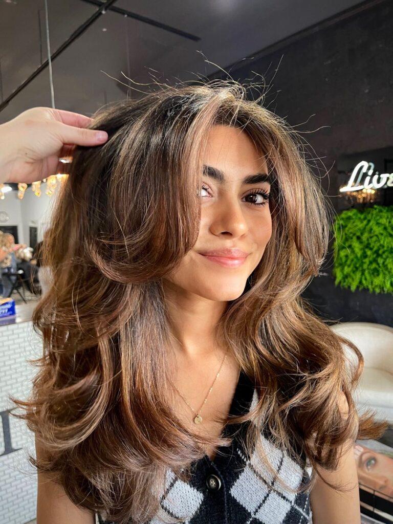 Textured layered blowout haircut with effortless movement