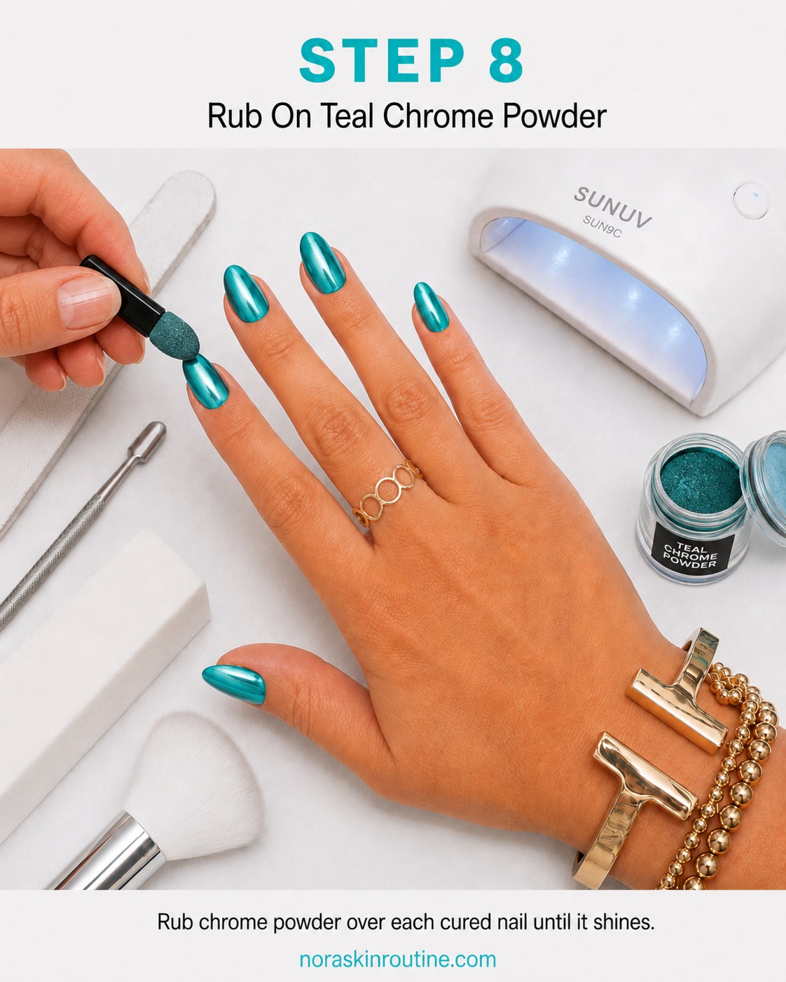 Rubbing loose teal chrome powder onto the tacky top coat until it turns mirror-like