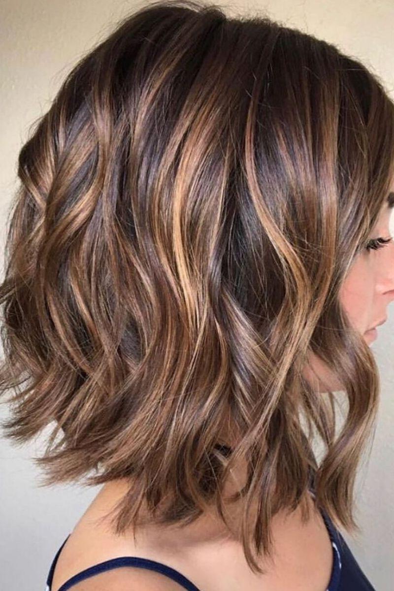 Wavy brown bob with golden highlights