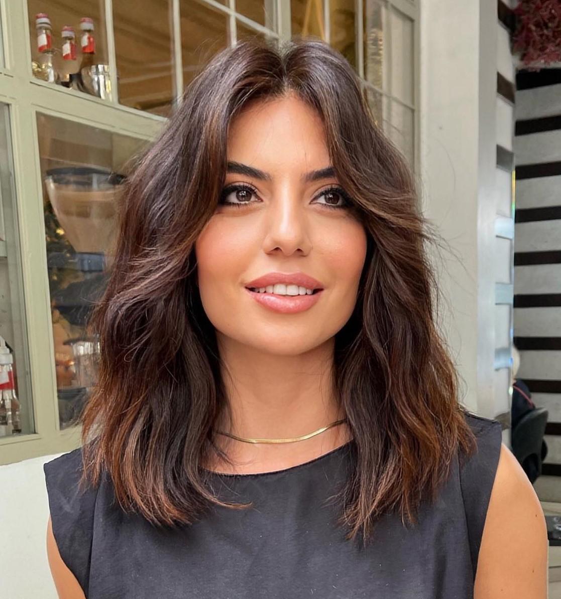 Thick hair wispy curtain bangs haircut