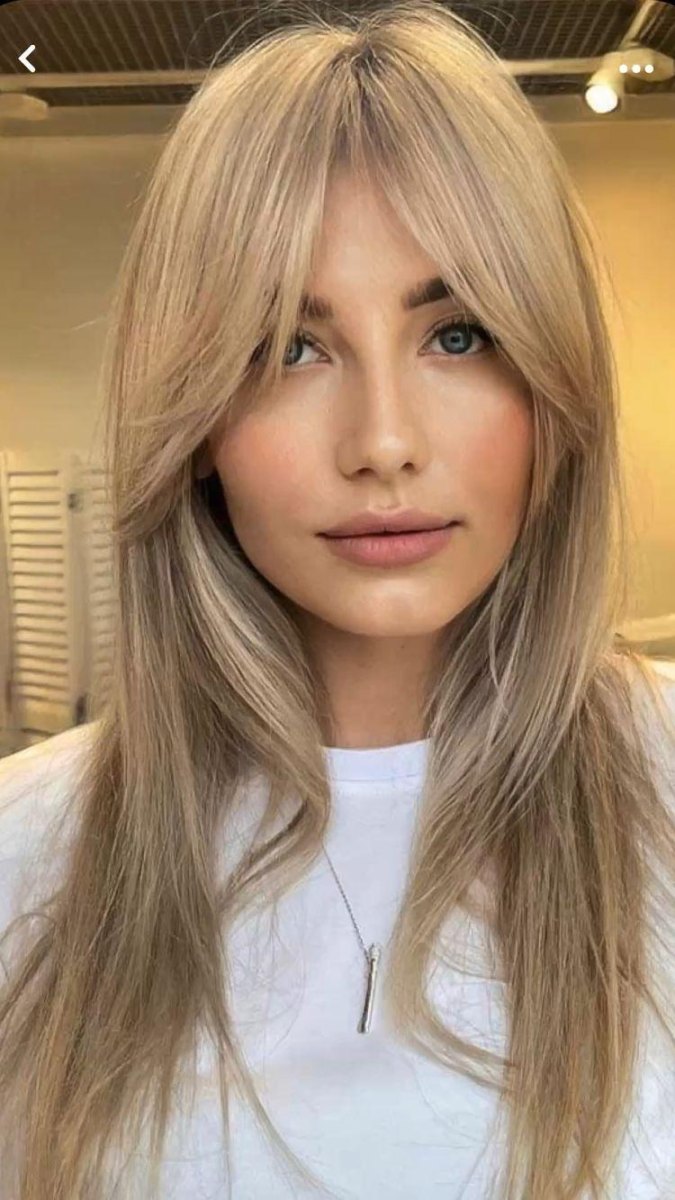 Middle part wispy curtain bangs