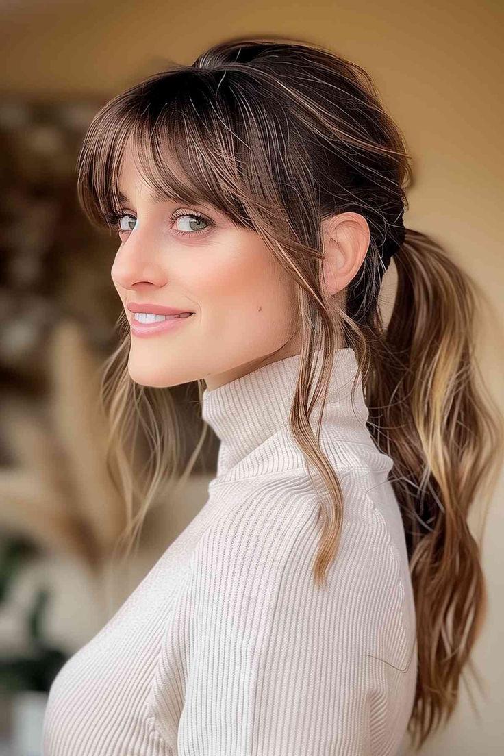 Ponytail with wispy curtain bangs